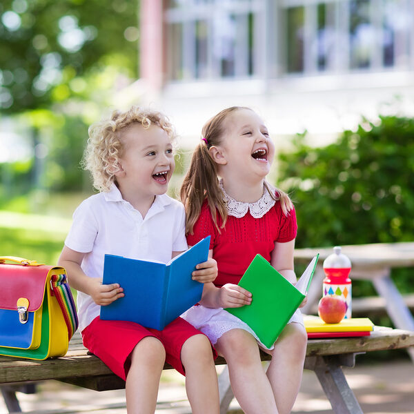 <p>Children go back to school. Start of new school year after summer vacation. Boy and girl with backpack and books on first school day. Beginning of class. Education for kindergarten and preschool kids.</p>
